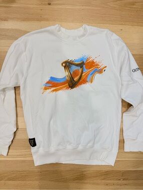 Guinness White Crewneck Sweater with Orange and Blue Harp Graphic